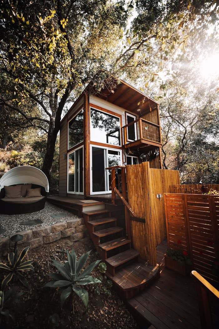 A stylish wooden cabin amidst green foliage, ideal for a serene getaway.